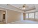 Bedroom featuring trey ceilings with attached bathroom and walk in closet at 4900 Raquet Ct, Duluth, GA 30096