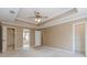 Bedroom with trey ceilings and ensuite bathroom with walk-in closet at 4900 Raquet Ct, Duluth, GA 30096