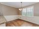 Cozy breakfast nook with hardwood floors, wainscoting, and large windows for natural light at 4900 Raquet Ct, Duluth, GA 30096