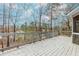 View of the home's wood deck with gray railings at 4900 Raquet Ct, Duluth, GA 30096