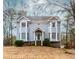 Charming two-story home features a quaint front porch, bay windows, and mature landscaping at 4900 Raquet Ct, Duluth, GA 30096