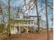 Rear exterior view showing a deck and screened-in porch at 4900 Raquet Ct, Duluth, GA 30096