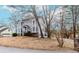 Exterior view of a two-story home with bay windows, landscaping, and a quaint front porch at 4900 Raquet Ct, Duluth, GA 30096