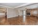 Spacious living room featuring a fireplace, hardwood floors, and natural light at 4900 Raquet Ct, Duluth, GA 30096