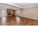 Spacious living room featuring a fireplace, hardwood floors, and natural light at 4900 Raquet Ct, Duluth, GA 30096