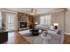 Staged living room featuring a fireplace, hardwood floors, and natural light at 4900 Raquet Ct, Duluth, GA 30096