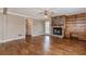 Spacious living room featuring a fireplace, hardwood floors, and natural light at 4900 Raquet Ct, Duluth, GA 30096