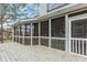 Spacious screened-in porch with wood decking at 4900 Raquet Ct, Duluth, GA 30096