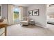 Living room with chair, side table, console table and artwork; neutral color walls and carpeted floors at 5603 Hislop Ln # 79, Mableton, GA 30126