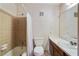 Traditional bathroom with tan tile, shower-tub combination, white sink and a large mirror at 6700 Roswell Rd # 11B, Atlanta, GA 30328