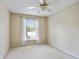 Bedroom featuring a ceiling fan and a bright window with curtains at 6700 Roswell Rd # 11B, Atlanta, GA 30328