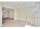 Bright upper landing featuring view to dining room and a staircase at 6700 Roswell Rd # 11B, Atlanta, GA 30328