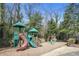 Community playground featuring a slide, play structure and swing set for Gathering fun at 6700 Roswell Rd # 11B, Atlanta, GA 30328