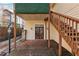 Covered outdoor patio with a staircase and stone accents at 1198 Piedmont Ne Ave # 103, Atlanta, GA 30309