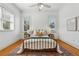 Light-filled bedroom with hardwood floors, a decorative rug, and a ceiling fan at 1198 Piedmont Ne Ave # 103, Atlanta, GA 30309