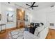 Bright living room featuring hardwood floors, a decorative fireplace and modern furnishings at 1198 Piedmont Ne Ave # 103, Atlanta, GA 30309