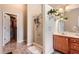 Bathroom with a glass enclosed shower and linen closet at 1756 Hedington Ct, Lawrenceville, GA 30045