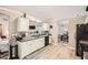 Kitchen featuring updated countertops, stainless sink, and an adjacent eating area at 1756 Hedington Ct, Lawrenceville, GA 30045