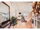 Bright living room featuring hardwood floors, a cozy fireplace, and an open layout leading to the dining area at 1756 Hedington Ct, Lawrenceville, GA 30045