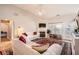 Inviting living room featuring hardwood floors, a fireplace, and comfortable seating with neutral decor at 1756 Hedington Ct, Lawrenceville, GA 30045