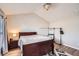 Main bedroom featuring vaulted ceilings, wood-look flooring, and updated fixtures at 1756 Hedington Ct, Lawrenceville, GA 30045