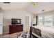 Main bedroom with lots of natural light, ceiling fan, wood-look flooring, and updated fixtures at 1756 Hedington Ct, Lawrenceville, GA 30045