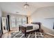 Main bedroom with lots of natural light, a ceiling fan, and wood-look flooring at 1756 Hedington Ct, Lawrenceville, GA 30045