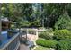 Expansive backyard features a deck, stone steps, pool, and lush landscaping at 3117 W Roxboro Ne Rd, Atlanta, GA 30324