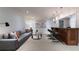 Wide basement view showing the sofa, coffee table, and bar area with pendant lights at 3117 W Roxboro Ne Rd, Atlanta, GA 30324