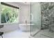 Elegant bathroom with a freestanding tub and a glass-enclosed shower at 3117 W Roxboro Ne Rd, Atlanta, GA 30324