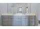 Elegant bathroom with a double sink vanity, quartz countertop, and modern fixtures at 3117 W Roxboro Ne Rd, Atlanta, GA 30324