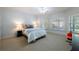 Bright bedroom featuring large windows, ceiling fan, and carpet floors at 3117 W Roxboro Ne Rd, Atlanta, GA 30324