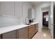 Modern kitchenette with stainless steel appliances, sleek cabinets, quartz countertop, and contemporary design at 3117 W Roxboro Ne Rd, Atlanta, GA 30324