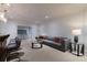 Modern living room with a gray sofa, bar, and stylish decor at 3117 W Roxboro Ne Rd, Atlanta, GA 30324