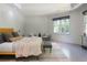 Light-filled main bedroom boasts hardwood floors and large windows, creating a serene atmosphere at 3117 W Roxboro Ne Rd, Atlanta, GA 30324