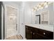 Bright bathroom features a granite-topped vanity with storage and stylish lighting at 3655 Habersham Ne Rd # B129, Atlanta, GA 30305