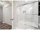 Bathroom featuring a shower-tub combination with marble-patterned walls at 3655 Habersham Ne Rd # B129, Atlanta, GA 30305