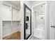 Bathroom leading to a closet with built-in storage shelves and modern marble tile at 3655 Habersham Ne Rd # B129, Atlanta, GA 30305