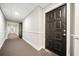 Well-lit hallway with neutral tones, leading to apartments, and a clean, welcoming common area at 3655 Habersham Ne Rd # B129, Atlanta, GA 30305