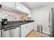 Well-lit kitchen featuring stainless steel appliances and a view into the living room at 3655 Habersham Ne Rd # B129, Atlanta, GA 30305