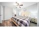 Bedroom with natural light, wood-look flooring, and view of the en-suite bathroom at 3655 Habersham Ne Rd # B129, Atlanta, GA 30305