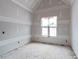 Unfinished bedroom with a window and sheetrocked walls at 628 Sandhill Hickory Level Rd, Carrollton, GA 30116