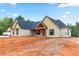 Beautiful new home with architectural roof, board and batten siding, and a covered porch at 628 Sandhill Hickory Level Rd, Carrollton, GA 30116