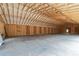 Unfinished garage interior showing concrete flooring, insulation and exposed wood framing at 628 Sandhill Hickory Level Rd, Carrollton, GA 30116