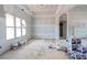 Unfinished living room with a large window and exquisite ceiling trim work at 628 Sandhill Hickory Level Rd, Carrollton, GA 30116