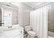 Bathroom featuring a shower, vanity and view into bedroom at 733 Vinings Estates Se Dr, Mableton, GA 30126