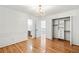 Bedroom featuring hardwood floors, white wainscoting, and chandelier at 733 Vinings Estates Se Dr, Mableton, GA 30126