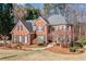 Traditional brick home with a well-manicured lawn and landscaping enhancing its curb appeal at 733 Vinings Estates Se Dr, Mableton, GA 30126