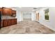 Open basement kitchenette with wood cabinetry, tiled backsplash, and ample natural light at 733 Vinings Estates Se Dr, Mableton, GA 30126