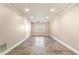 Spacious, finished room with tile flooring, white trim, and natural light from a window at 733 Vinings Estates Se Dr, Mableton, GA 30126